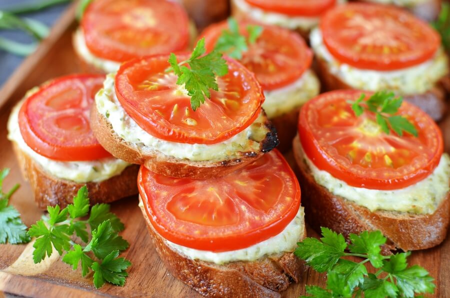 Grilled Crostini with Garlic Scape Cream Cheese and Tomatoes