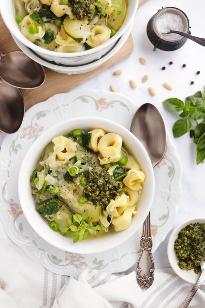 A Broth Soup with Tortellini Pasta and Greens